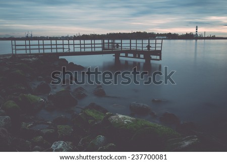 old bridge with rusty metal rails near sea port - retro, vintage style look