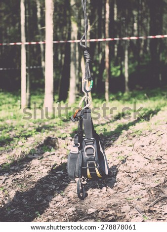 tree climbing equipment in forest with slacklines and mountings - retro vintage grainy film look