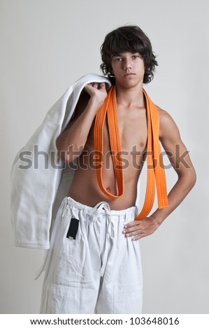 Young fighter posing isolated against a light background