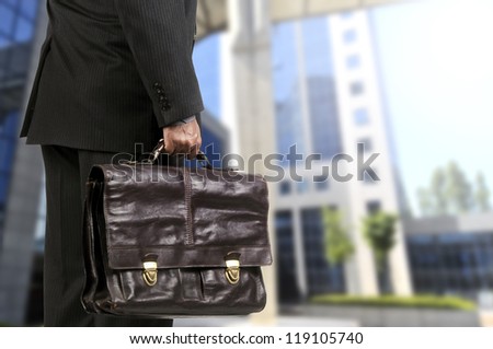 body part of a businessman with briefcase