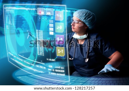 Doctor in uniform with X-rays and digital  screens and keyboard