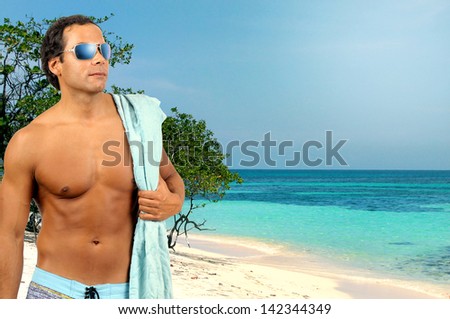 Handsome young man posing in swim wear