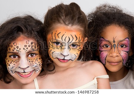 Beautiful young girls with animal painted faces Beautiful young girls with animal painted faces