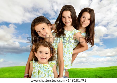 Group of young girls posing outdoors