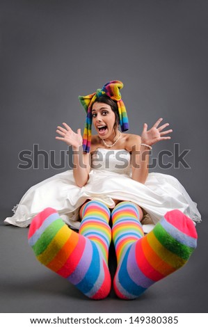 Funny bride with colorful socks and scarf