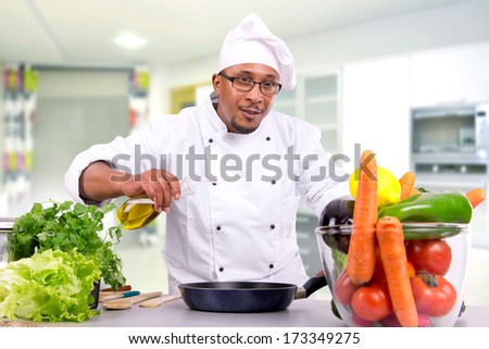 Male chef with fruits and vegetables cooking