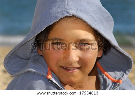 Boy posing with hooded shirt