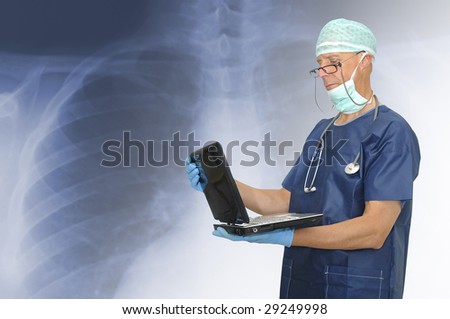 Doctor with laptop and an X-ray as background
