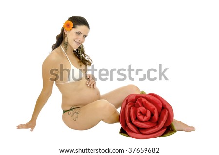 stock photo : Pregnant woman with tattoo posing in bikini with a red rose 