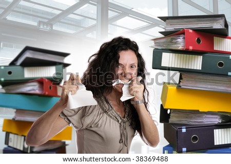 Insane woman with stacks of files around isolated in white