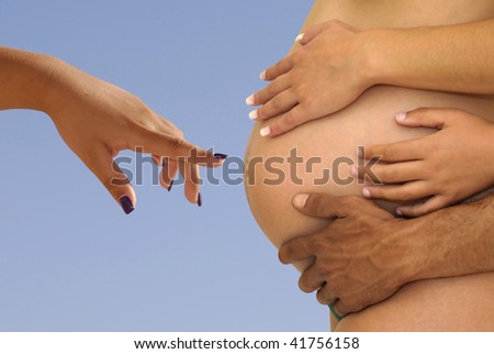 Hands pointing to a pregnant belly with hands all around