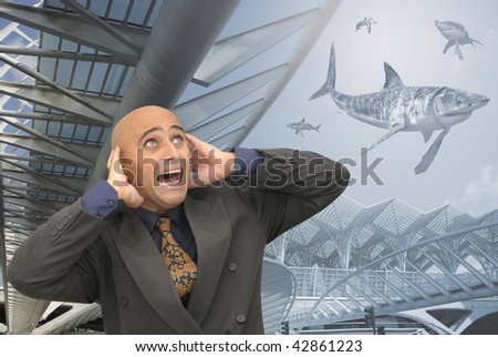 Businessman screaming with sharks all around
