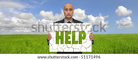 Worried man holding a  board with the word help, for environment