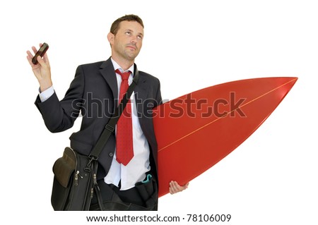 Young businessman with surf board recieving a call from the office