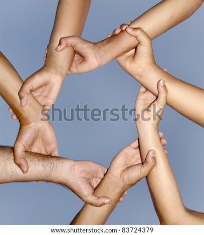 Human hands together in a strong link