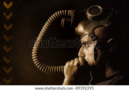 Man with gas mask in a grunge background
