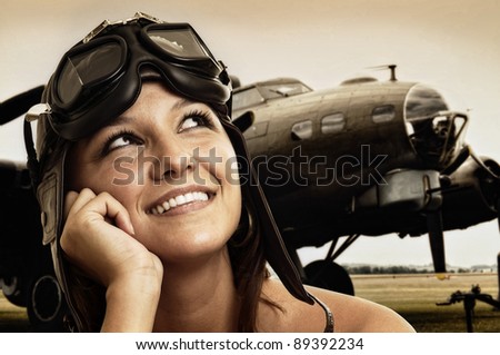 Beautiful young pilot hat and goggles