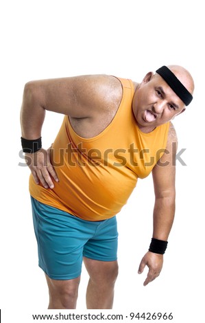 Large and tired fitness man with back pain isolated in white