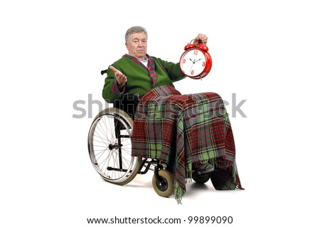 Lonely elderly in a wheelchair with big clock ticking...
