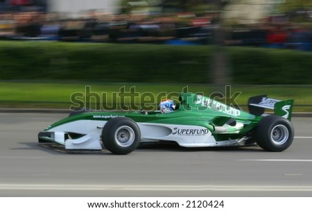 Green Race car at a demonstrative show in Bucharest Ring Tour