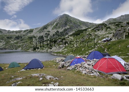 Mountain landscape with tent camp on the morning time