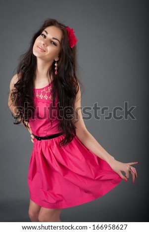 model in a short pink dress