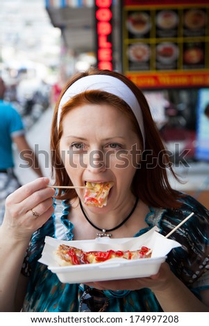 woman eating on the go
