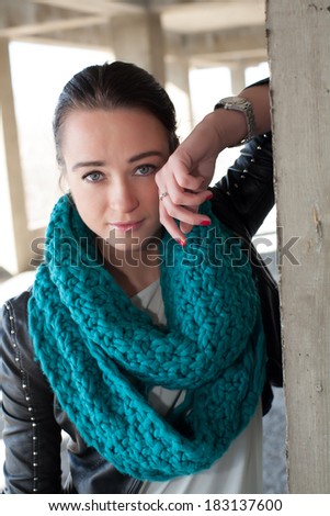 Girl in leather jacket with scarf