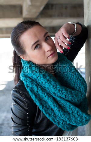 Girl in leather jacket with scarf