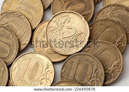 Coin twenty euro cents coins on a background of ten rubles