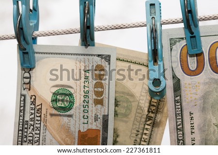 Money drying on the clothesline. The concept of money laundering