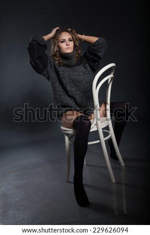 girl sits on a chair