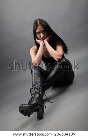 Girl in leather pants and boots
