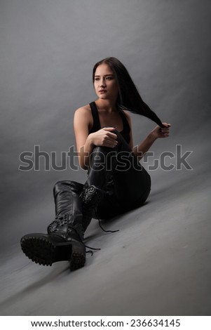 Girl in leather pants and boots