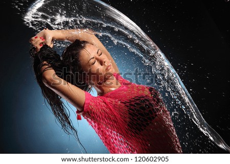 portrait of beautiful girl with splashes of water