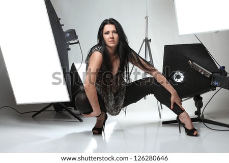 an active girl with a interesting happy emotions in studio shooting