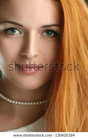 portrait of beautiful girl with red hair