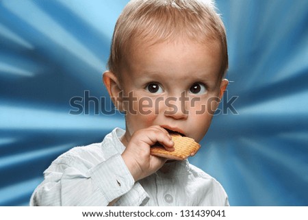 little boy eating cookies
