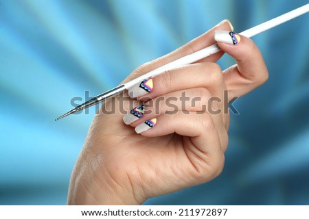 elegant hand with a nice manicure. original drawing on nails