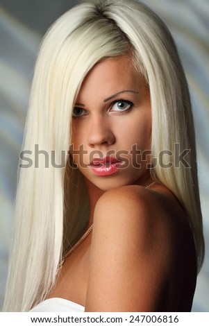 portrait of a beautiful woman. blonde, beautiful, long hair. good makeup. sexy look