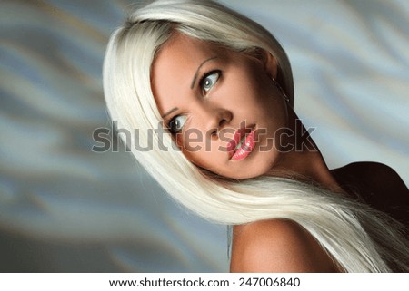 portrait of a beautiful woman. blonde, beautiful, long hair. good makeup. sexy look