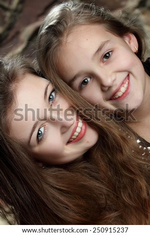 two young girls, sisters. sincere emotions. active. beautiful smile