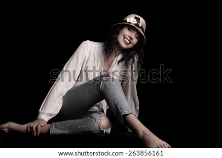 young beautiful woman in hat . flirty look. Game emotions. beautiful figure