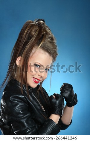 girl rocker the stylish hairstyle and bright emotions. leather clothes