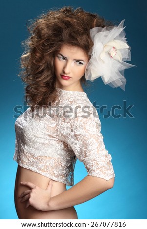 portrait of a woman with a flower in hair. fashion makeover. sexy lips. sensual look, bright smile. groomed skin
