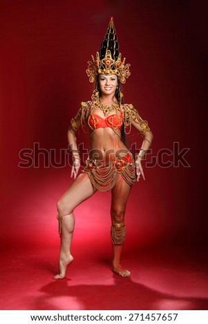 beautiful girl dressed like a Thai dancer. dance moves. beautiful colorful costumes, vivid emotions
