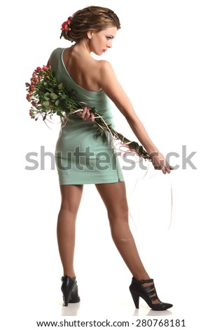 young beautiful woman with flowers on a white background. good figure, stylish hairstyle and makeup.