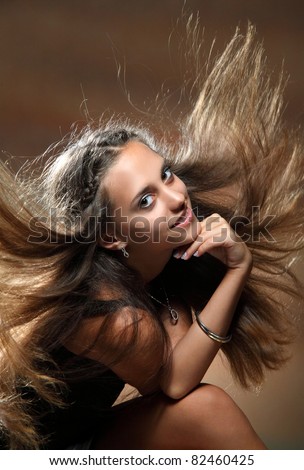 Portrait of young dancing girl with smart fair hair