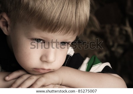 portrait of a little boy with sad eyes