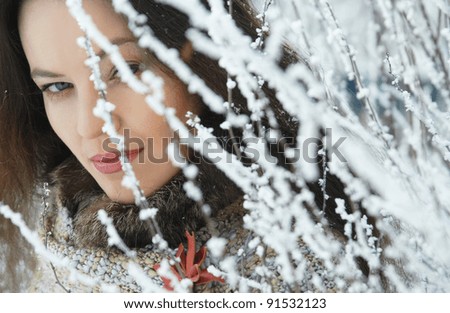 portrait beautiful girl in snowy forest